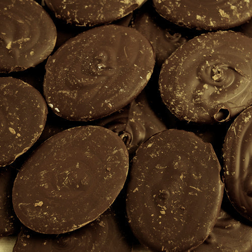 a pile of Kokoa Collections Madagascar 82% hot chocolate award winning pebbles