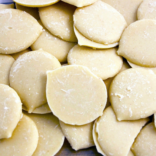 a pile of Kokoa Collections Ivory Coast White hot chocolate award winning pebbles