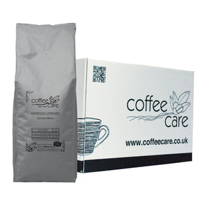 one white Coffee Care box with a grey recyclable kilo packet of Coffee Care's Espresso Lorenzo Espresso Beans lent up next to it. 