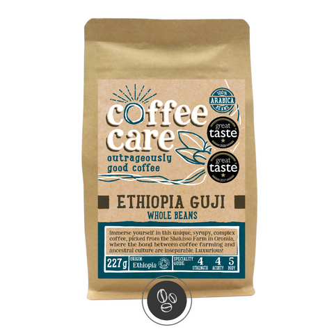 A 227g kraft packet of Coffee Care’s Ethiopia Guji Coffee. Blue label for whole beans. From the Shakkiso Farm, Oromia Region, Ethiopia coffee. 100% Arabica whole beans. Great taste winner 2020 & 2021