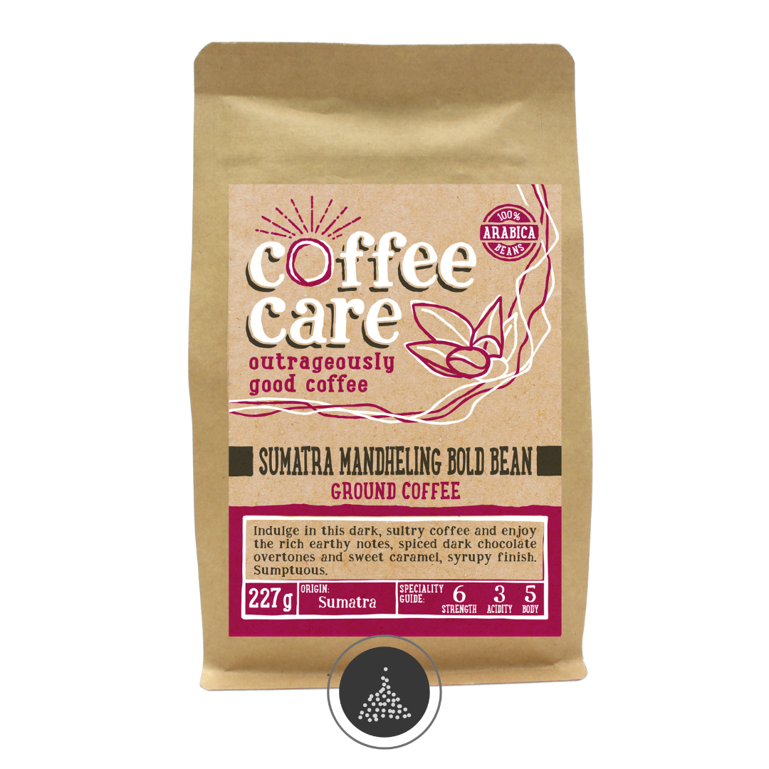 A 227g kraft packet of Coffee Care’s Sumatra Mandheling Bold Bean ground coffee. Pink label ground for filter & cafetiere. Freshly roasted & ground Sumatran Coffee. 100% Arabica Beans