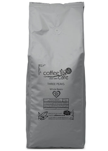 one kilo grey recyclable packet of Coffee Care's Three Peaks Beans. 100% Arabica coffee from Kenya, Central and South America. Farm Shop and Deli Winner, Deliciuousl;y Yorkshire Best Beverage Winner