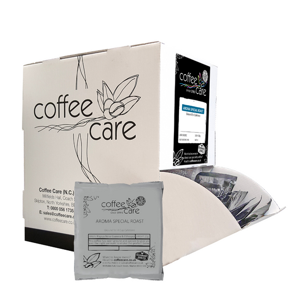 Coffee Care dispenser box of 100 grey recyclable packets of 20g Aroma Special Roast cafetiere coffee. A white dispenser box with 1 cafetiere sachet lent up next to it.