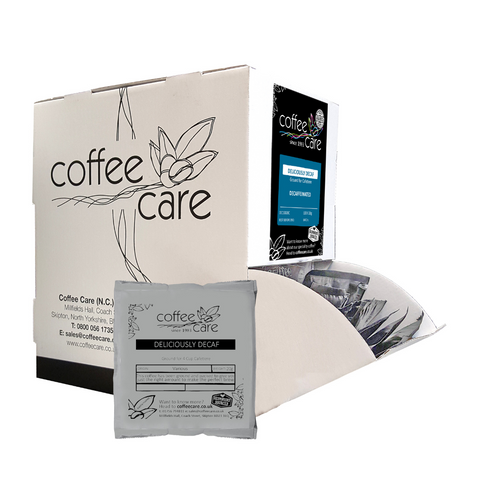 Coffee Care dispenser box of 100 grey recyclable packets of 20g Deliciously Decaf cafetiere coffee. A white dispenser box with 1 cafetiere sachet lent up next to it.