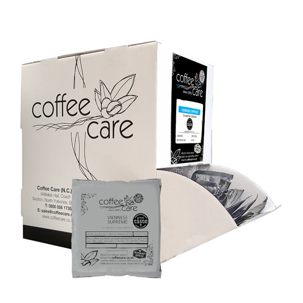 A Coffee Care dispenser box of 100 grey recyclable packets of 15g Viennese Supreme cafetiere coffee. A white dispenser box with 1 cafetiere sachet lent up next to it.