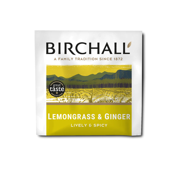 A single yellow enveloped tea bag of Birchall Lemongrass & Ginger. Lively & spicy. Natural Infusion. Great Taste Winner