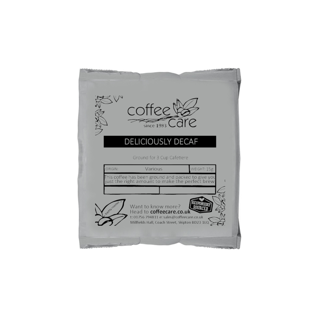 A single packet of 15g cafetiere coffee in grey recyclable packaging. Coffee Care's Deliciously Decaf decaffeinated cafetiere coffee.