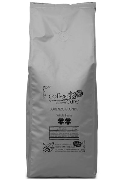 A 1 kilo grey recyclable packet of Coffee Care’s Lorenzo Blonde Coffee. Ethiopia, Brazil, India whole coffee beans. 100% Arabica whole beans. Great Taste winner 2023 and 2024