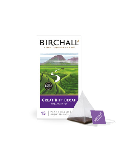 Front view of cardboard box of 15 Birchall Great Rift Decaf prism tea bags. Green hill graphics with purple band, East Africa’s finest tea, breakfast blend. Decaffeinated. with one prism teabag displayed next to box