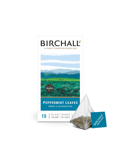 Front view of cardboard box of 15 Birchall Peppermint prism tea bags. Blue hill graphics with blue band, fresh & invigorating, natural infusion. Caffeine free. Great Taste winner 2013 with one prism teabag displayed next to box