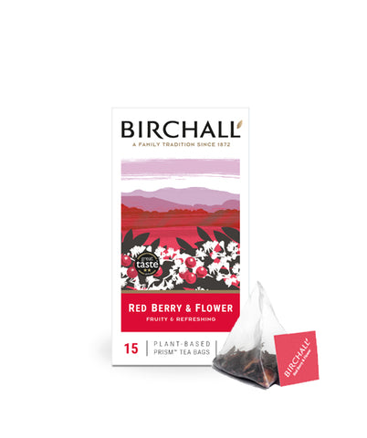 Front view of cardboard box of 15 Birchall Red Berry & Flower prism tea bags. Red hill graphics with red band, fruity & refreshing, natural infusion. Caffeine free. Great Taste winner 2013 with one prism teabag displyed next to box