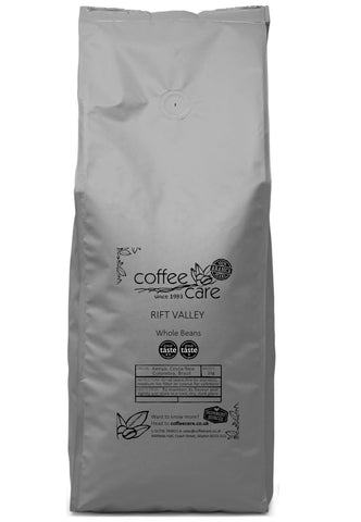 one kilo grey recyclable packet of Coffee Care's Rift Valley. 100% Arabica coffee from Kenya, Central and South America. 100% Arabica, Great Taste Winner 2017, 2022 and 2024