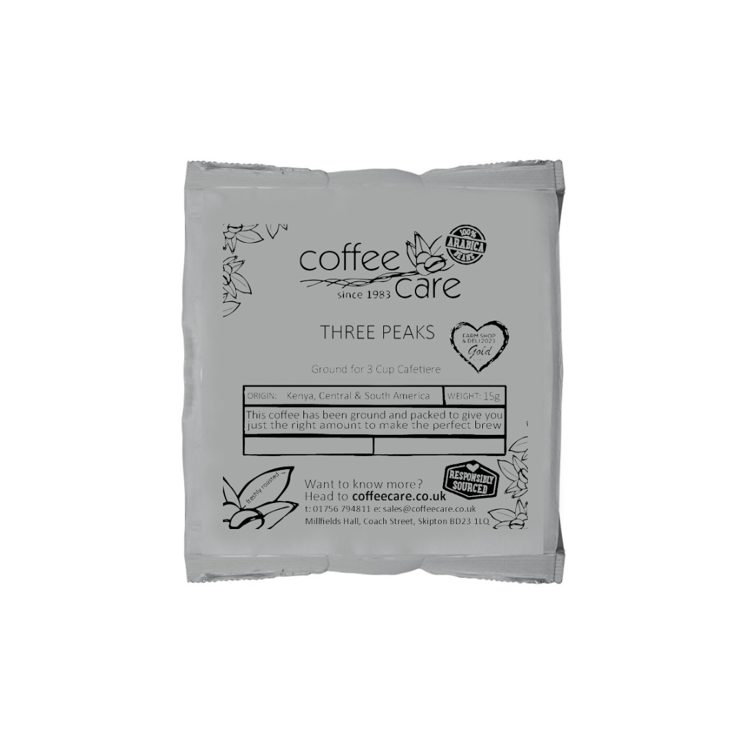 A single packet of 15g cafetiere coffee in grey recyclable packaging. Coffee Care's Three Peaks cafetiere coffee. 100% arabica coffee from Kenya, Central and South America.