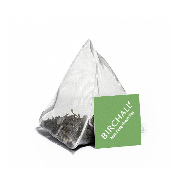 A single Birchall Plant Based Tagged Prism Tea Bag. Birchall Mao Feng Green Tea