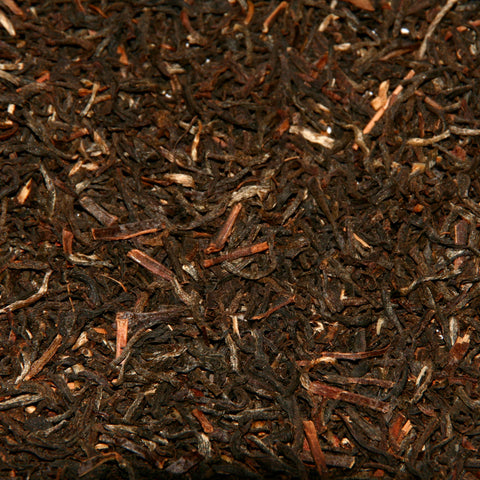 A close up image of Assam loose leaf tea leaves.