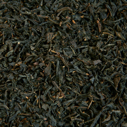 A close up image of Earl Grey loose leaf tea leaves.