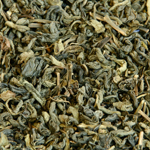 A close up image of Formosa Gunpowder loose leaf tea leaves.