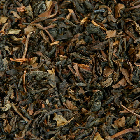 A close up image of Formosa Oolong loose leaf tea leaves.