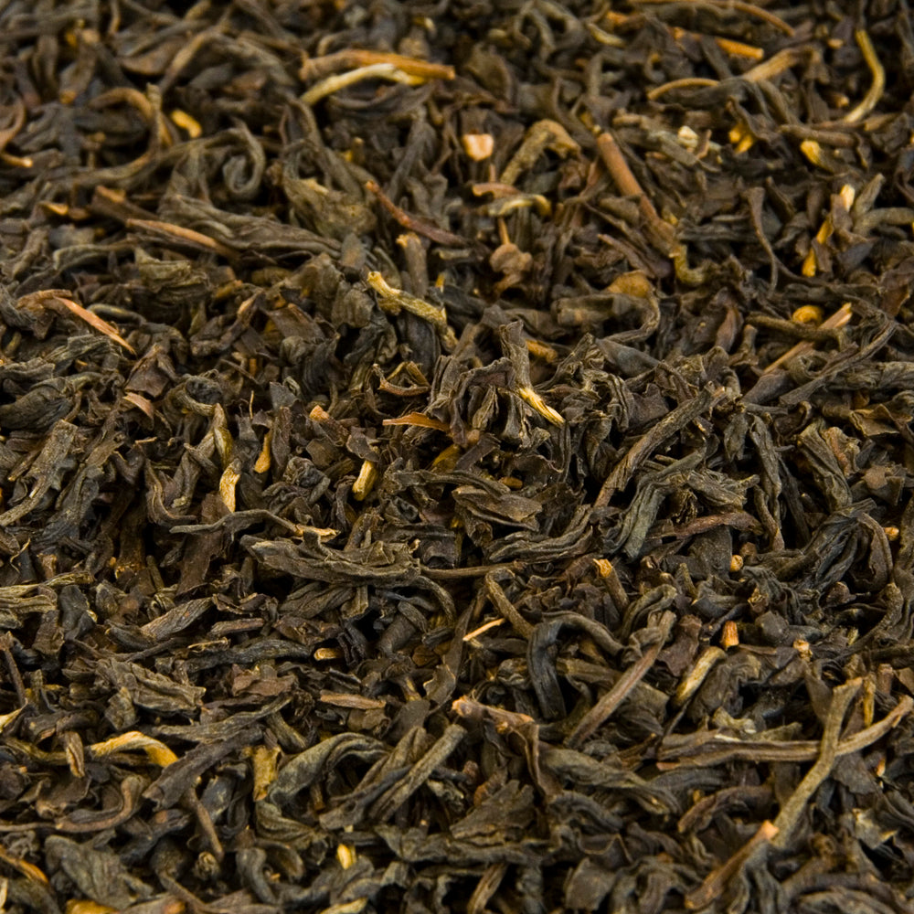 A close up image of Lapsang Soushong loose leaf tea leaves.