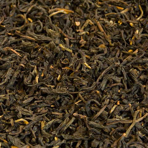 A close up image of Lapsang Soushong loose leaf tea leaves.