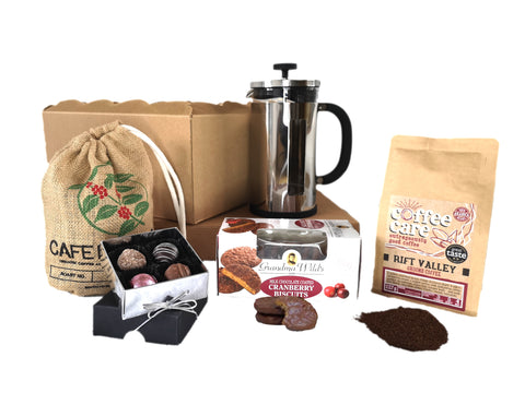 Hamper with speciality coffee care coffee, 8 cup la cafetiere chrome pisa cafetiere, box of grandma wilds cranberry biscuits and a box of whitakers chocolate truffles.