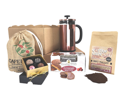 Hamper with speciality coffee care coffee, 8 cup la cafetiere copper pisa cafetiere, box of grandma wilds cranberry biscuits and a box of whitakers chocolate truffles.
