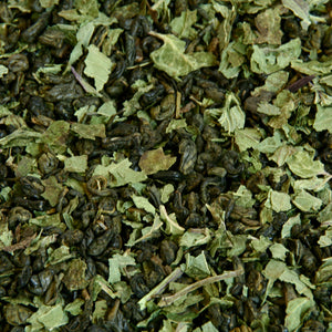 A close up image of Peppermint Green loose leaf tea leaves.